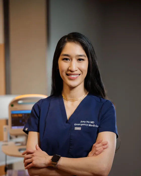Amy Faith Ho, MD, in scrubs in the emergency department