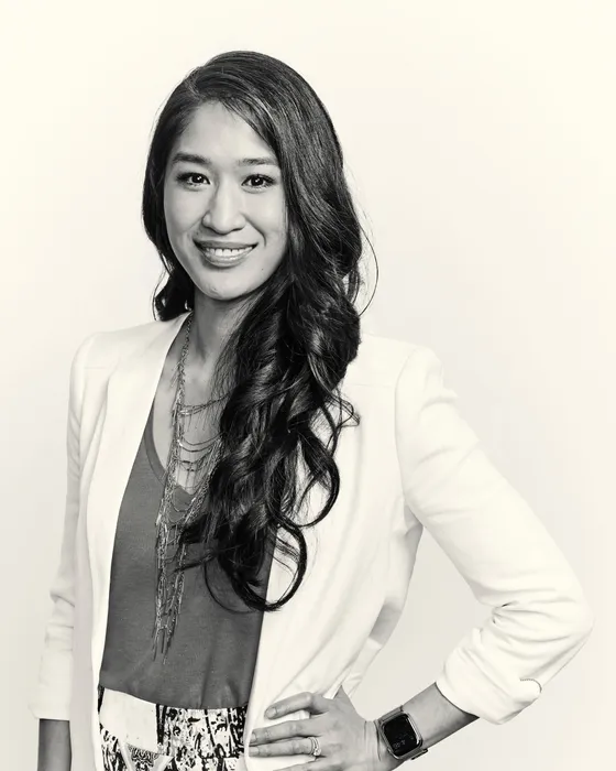 Amy Faith Ho, MD — editorial portrait in a white blazer